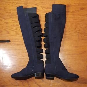 Pair of Nine West knee high boots with strappy backs. Size 6.5
